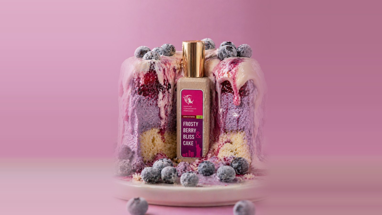 Frosty Berry & Bliss Cake bottle inside a layered berry cake topped with frosted blueberries on a pink background
